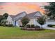 Charming home featuring mature landscaping, lawn, and an inviting entrance at 528 Sea Foam St, Summerville, SC 29486