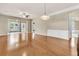 Spacious living room showcasing hardwood floors, a ceiling fan, and backyard access at 528 Sea Foam St, Summerville, SC 29486