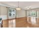Spacious living room with hardwood floors, bright windows, and overhead lighting at 528 Sea Foam St, Summerville, SC 29486