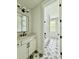 Modern bathroom features a white vanity, a large mirror, and a connecting room with a shower and tub at 5702 Barbary Coast Rd, Hollywood, SC 29449