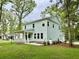 Charming two-story home with a spacious yard and inviting front porch at 5702 Barbary Coast Rd, Hollywood, SC 29449