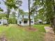 Beautiful two-story home with a covered porch and spacious backyard at 5702 Barbary Coast Rd, Hollywood, SC 29449