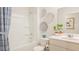 Well-lit bathroom featuring a shower and tub, a vanity with a sink, and modern fixtures at 718 Long Bluff Rd, Summerville, SC 29486