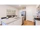 Modern kitchen with granite counters, stainless steel appliances and wood flooring, bright and clean at 718 Long Bluff Rd, Summerville, SC 29486