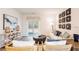 Bright living room boasts stylish decor and sliding glass doors leading to the outdoors at 718 Long Bluff Rd, Summerville, SC 29486