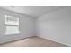 A bright bedroom featuring neutral carpeting and a window with blinds at 807 Long Bluff Rd, Summerville, SC 29486