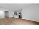Spacious living room with wood floors and a view into the kitchen with granite countertops at 807 Long Bluff Rd, Summerville, SC 29486