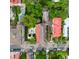Aerial perspective capturing the property's backyard with mature landscaping in a neighborhood setting at 81 Rutledge Ave, Charleston, SC 29401