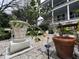 Tranquil garden featuring a variety of plants, gravel, and a view of the charming home at 81 Rutledge Ave, Charleston, SC 29401