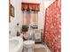 Cozy bathroom with patterned shower curtain, classic fixtures, and natural light at 81 Rutledge Ave, Charleston, SC 29401