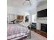 Bright bedroom with ceiling fan, fireplace and large window at 81 Rutledge Ave, Charleston, SC 29401