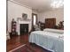 Spacious bedroom with hardwood floors, a fireplace, and twin beds offers a cozy retreat at 81 Rutledge Ave, Charleston, SC 29401