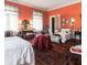 Cozy bedroom showcasing twin beds, vintage furnishings, and natural light at 81 Rutledge Ave, Charleston, SC 29401