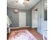 Bedroom featuring tile flooring, a small rug, and access to another room at 81 Rutledge Ave, Charleston, SC 29401