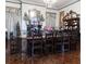 Grand dining area boasting a long wood table, decorative fireplace, and period furnishings at 81 Rutledge Ave, Charleston, SC 29401
