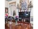 Formal dining room features a long wood table with vase centerpieces and decorative fireplace at 81 Rutledge Ave, Charleston, SC 29401