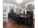 Formal dining room with a large wooden table, decorative fireplace, and traditional decor at 81 Rutledge Ave, Charleston, SC 29401