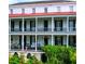 Classic architecture with double balconies, showcasing the home's refined exterior details and charm at 81 Rutledge Ave, Charleston, SC 29401