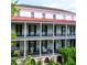 Detailed shot of the building's exterior showcasing its columned balconies and classical architectural design at 81 Rutledge Ave, Charleston, SC 29401
