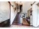 Elegant foyer with dark wood stairs, chandelier, and detailed decor at 81 Rutledge Ave, Charleston, SC 29401