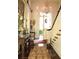 Grand foyer with antique furniture, chandelier, and ornate details, showcasing the home's elegance at 81 Rutledge Ave, Charleston, SC 29401