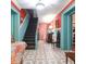 Entry foyer with colorful walls, black staircase and patterned tile floors at 81 Rutledge Ave, Charleston, SC 29401