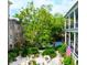 Lush garden offering a serene outdoor retreat alongside charming architecture, and American flag at 81 Rutledge Ave, Charleston, SC 29401