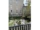 A charming garden area with lush greenery and gravel pathways, creating a serene outdoor space at 81 Rutledge Ave, Charleston, SC 29401