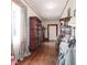 Hallway features hardwood floors, display shelving and lovely natural light at 81 Rutledge Ave, Charleston, SC 29401