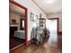 Hallway view into bedroom with hardwood floors and decorative furnishings at 81 Rutledge Ave, Charleston, SC 29401
