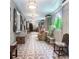 Hallway with vintage-style patterned tile, comfortable seating, and decorative architectural details at 81 Rutledge Ave, Charleston, SC 29401