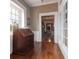 Hallway featuring hardwood floors, large window, and ornate wooden desk at 81 Rutledge Ave, Charleston, SC 29401