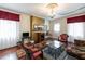 Living room with a fireplace, hardwood floors, and classic decor creating a comfortable and stylish space at 81 Rutledge Ave, Charleston, SC 29401