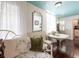 Comfortable seating area with a large mirror, sheer curtains, and a view to a table and chairs at 81 Rutledge Ave, Charleston, SC 29401