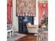 Elegant living room features a fireplace, decorative accents, and red patterned curtains at 81 Rutledge Ave, Charleston, SC 29401