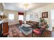 Comfortable living room featuring hardwood floors, decorative accents, and plenty of natural light at 81 Rutledge Ave, Charleston, SC 29401