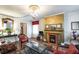 Inviting living room with a fireplace, decorative accents, and comfortable seating on hardwood floors at 81 Rutledge Ave, Charleston, SC 29401