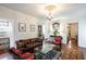 Cozy living room with hardwood floors, a decorative ceiling medallion, and comfortable seating at 81 Rutledge Ave, Charleston, SC 29401