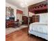Spacious main bedroom with sitting area, canopy bed, and traditional decor at 81 Rutledge Ave, Charleston, SC 29401