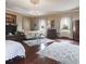 Expansive main bedroom with a sitting area, decorative rugs, and traditional decor at 81 Rutledge Ave, Charleston, SC 29401