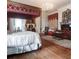 Serene main bedroom featuring a canopy bed, sitting area, and traditional furnishings at 81 Rutledge Ave, Charleston, SC 29401