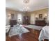 Large main bedroom featuring a sitting area, ornate rugs, and beautiful lighting at 81 Rutledge Ave, Charleston, SC 29401