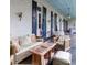 Comfortable porch seating with vintage wood furniture, offering a relaxing outdoor living space at 81 Rutledge Ave, Charleston, SC 29401