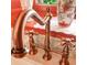 Elegant copper sink faucet with traditional cross handles, adding vintage charm to the bathroom at 81 Rutledge Ave, Charleston, SC 29401