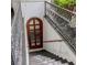 View of a staircase with decorative iron railing and door with glass windows at 81 Rutledge Ave, Charleston, SC 29401