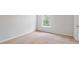 Bright bedroom featuring neutral carpet, fresh paint, and a window bringing natural light at 810 Long Bluff Rd, Summerville, SC 29486