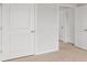 Bedroom closets featuring modern paneled doors, fresh paint, and carpeted floors at 810 Long Bluff Rd, Summerville, SC 29486