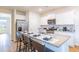 Open kitchen featuring white cabinets, granite countertops, stainless steel appliances, and a breakfast bar at 812 Long Bluff Rd, Summerville, SC 29486