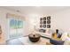 Bright living room with stylish decor, modern furniture, and sliding glass doors to the outside at 812 Long Bluff Rd, Summerville, SC 29486