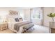 Serene main bedroom featuring soft neutral tones, a large window, and comfortable furnishings at 812 Long Bluff Rd, Summerville, SC 29486